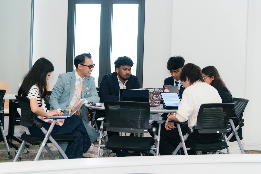 Small group collaborating around a table